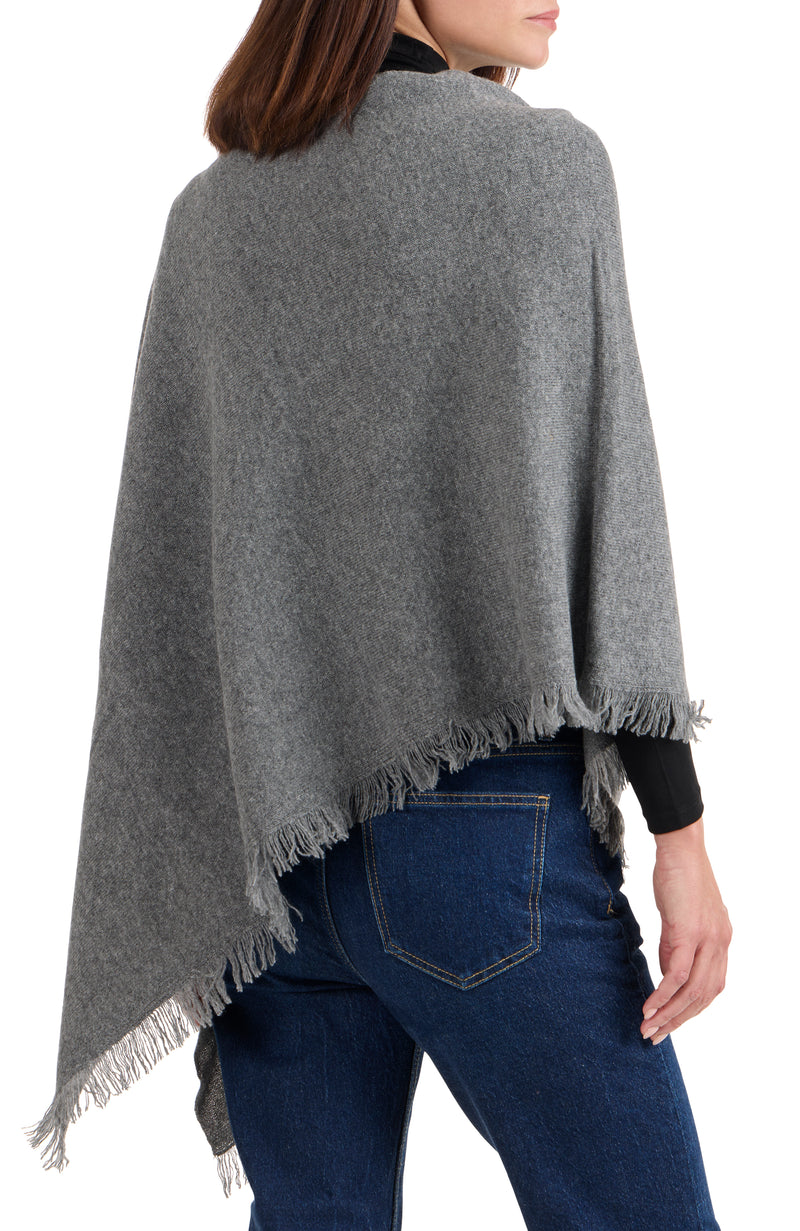 model wearing CASHMERE FRINGE JERSEY ASYMMETRICAL PONCHO in medium grey back