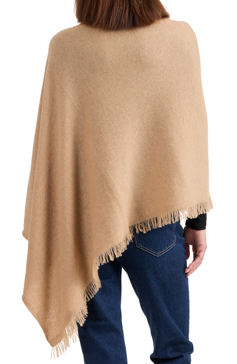 model wearing CASHMERE FRINGE JERSEY ASYMMETRICAL PONCHO in camel back