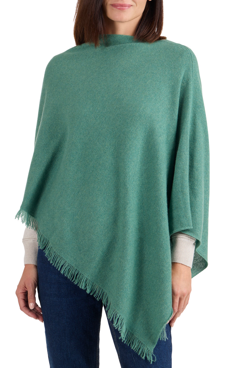 model wearing CASHMERE FRINGE JERSEY ASYMMETRICAL PONCHO in aspen front