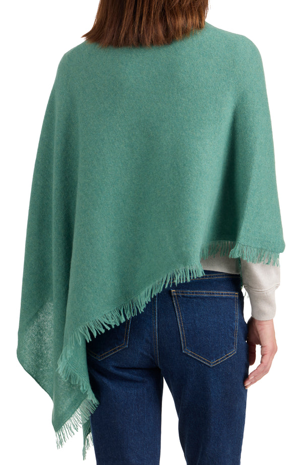 model wearing CASHMERE FRINGE JERSEY ASYMMETRICAL PONCHO in aspen back