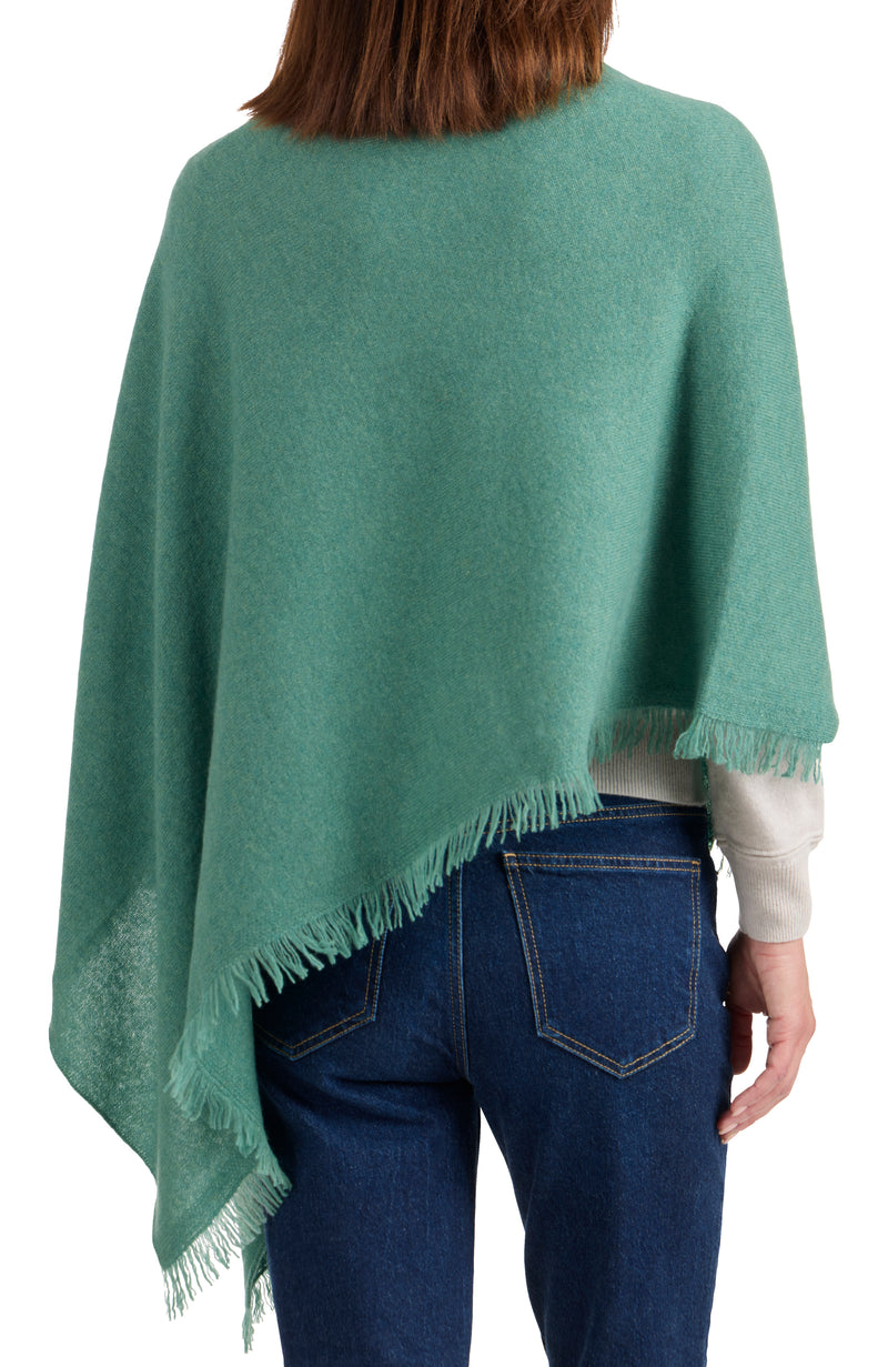 model wearing CASHMERE FRINGE JERSEY ASYMMETRICAL PONCHO in aspen back