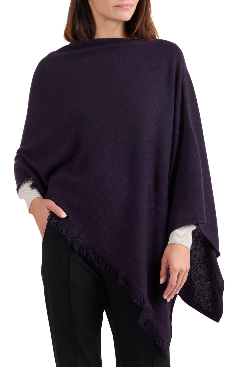 model wearing CASHMERE FRINGE JERSEY ASYMMETRICAL PONCHO in dark currant front