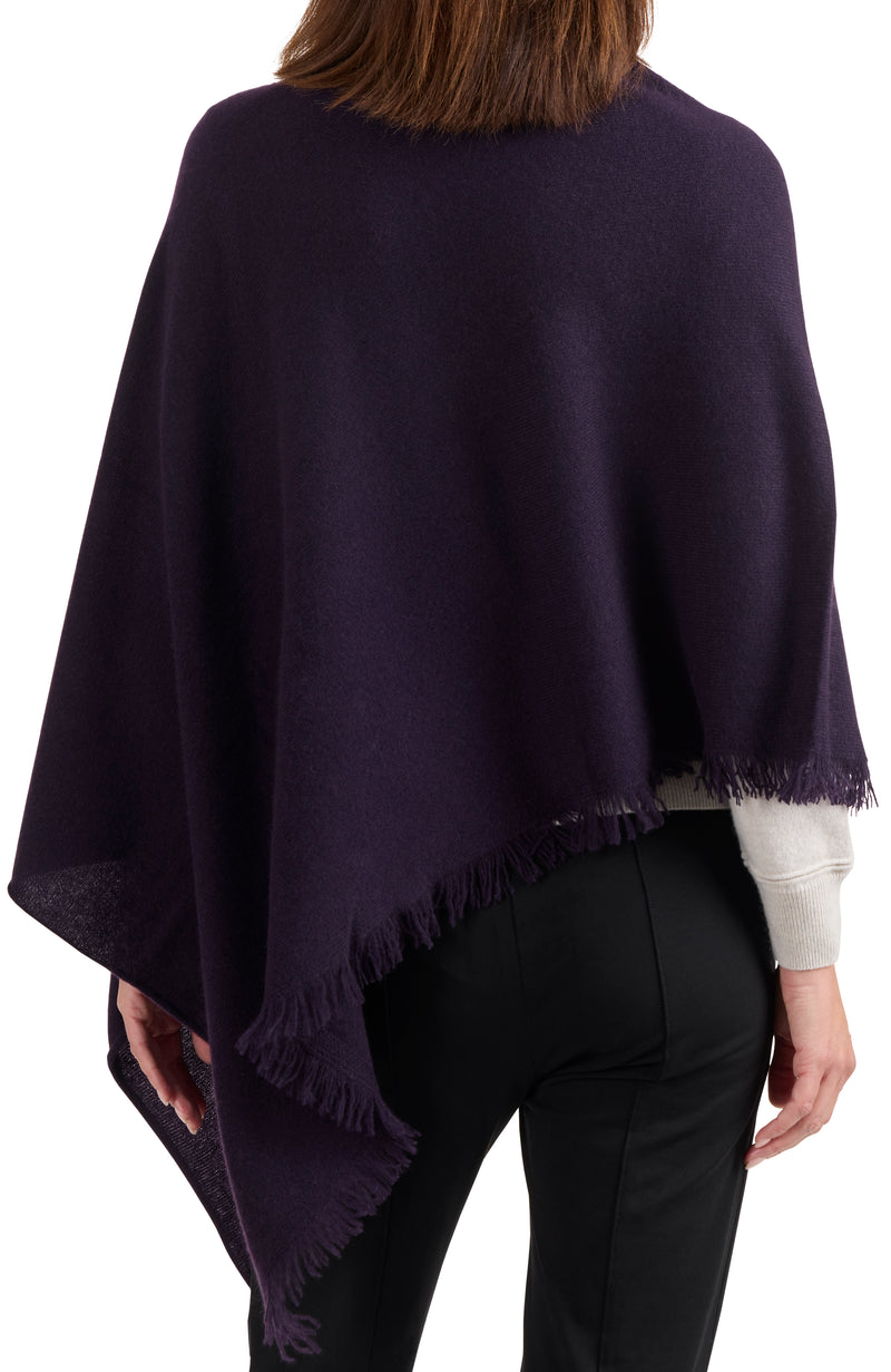 model wearing CASHMERE FRINGE JERSEY ASYMMETRICAL PONCHO in dark currant back