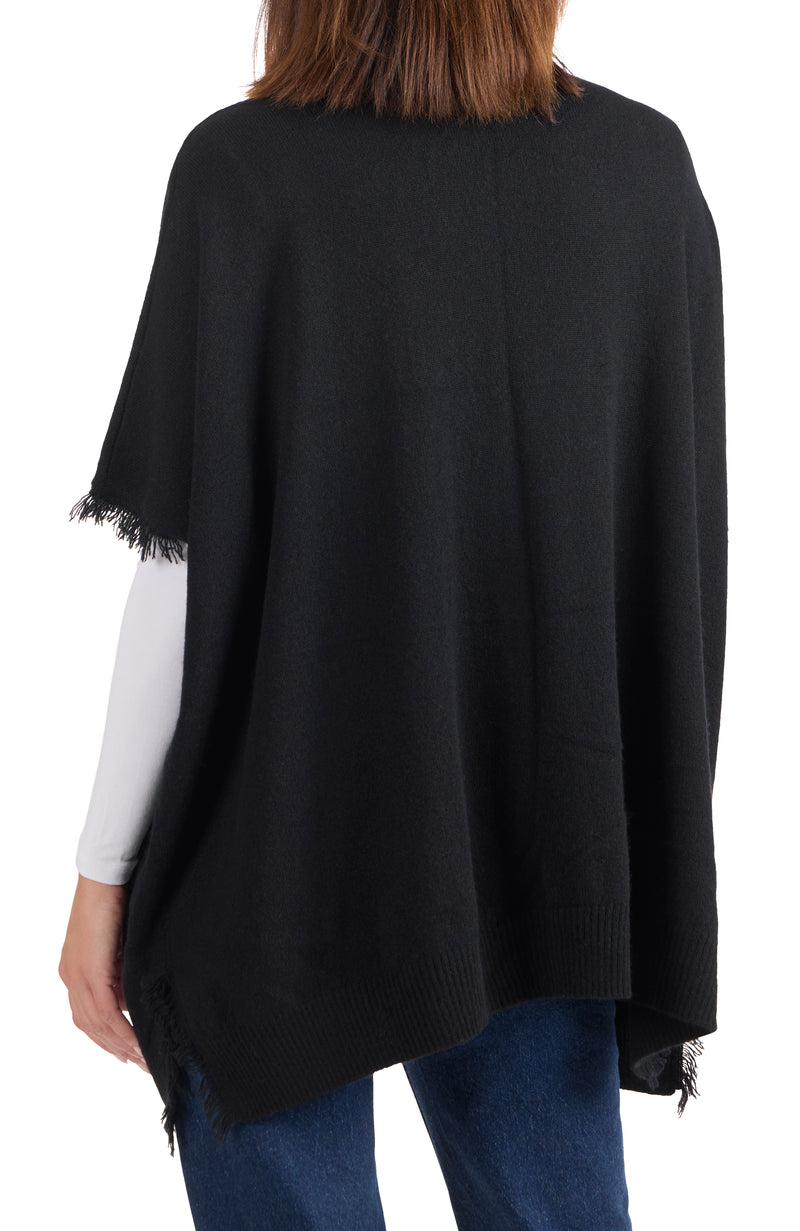 model wearing CASHMERE KNIT CAPE WITH FRINGE in black back