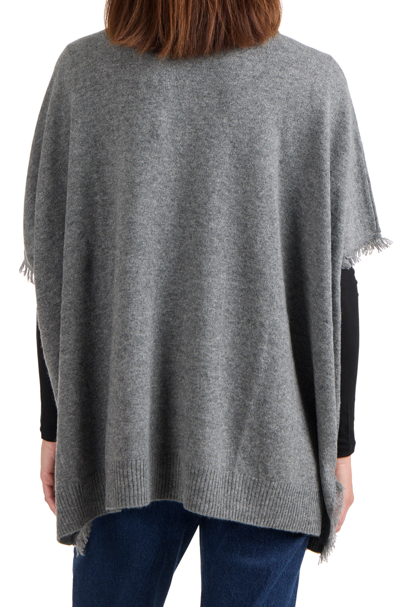 model wearing CASHMERE KNIT CAPE WITH FRINGE in medium grey back