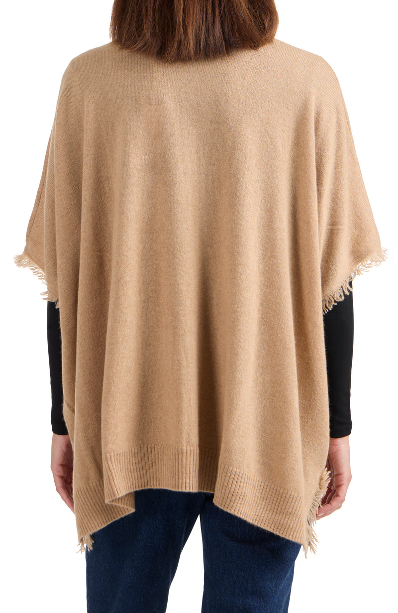 model wearing CASHMERE KNIT CAPE WITH FRINGE in camel back