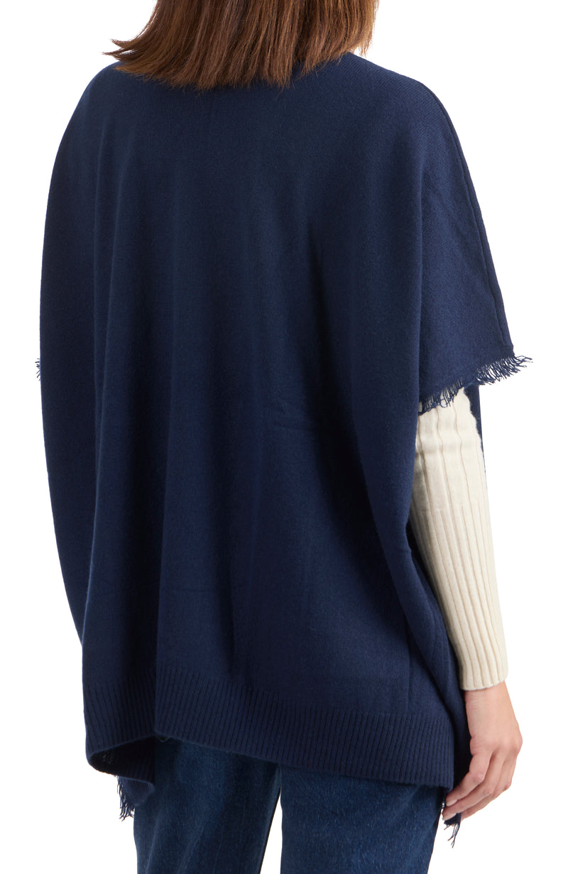 model wearing CASHMERE KNIT CAPE WITH FRINGE in navy back