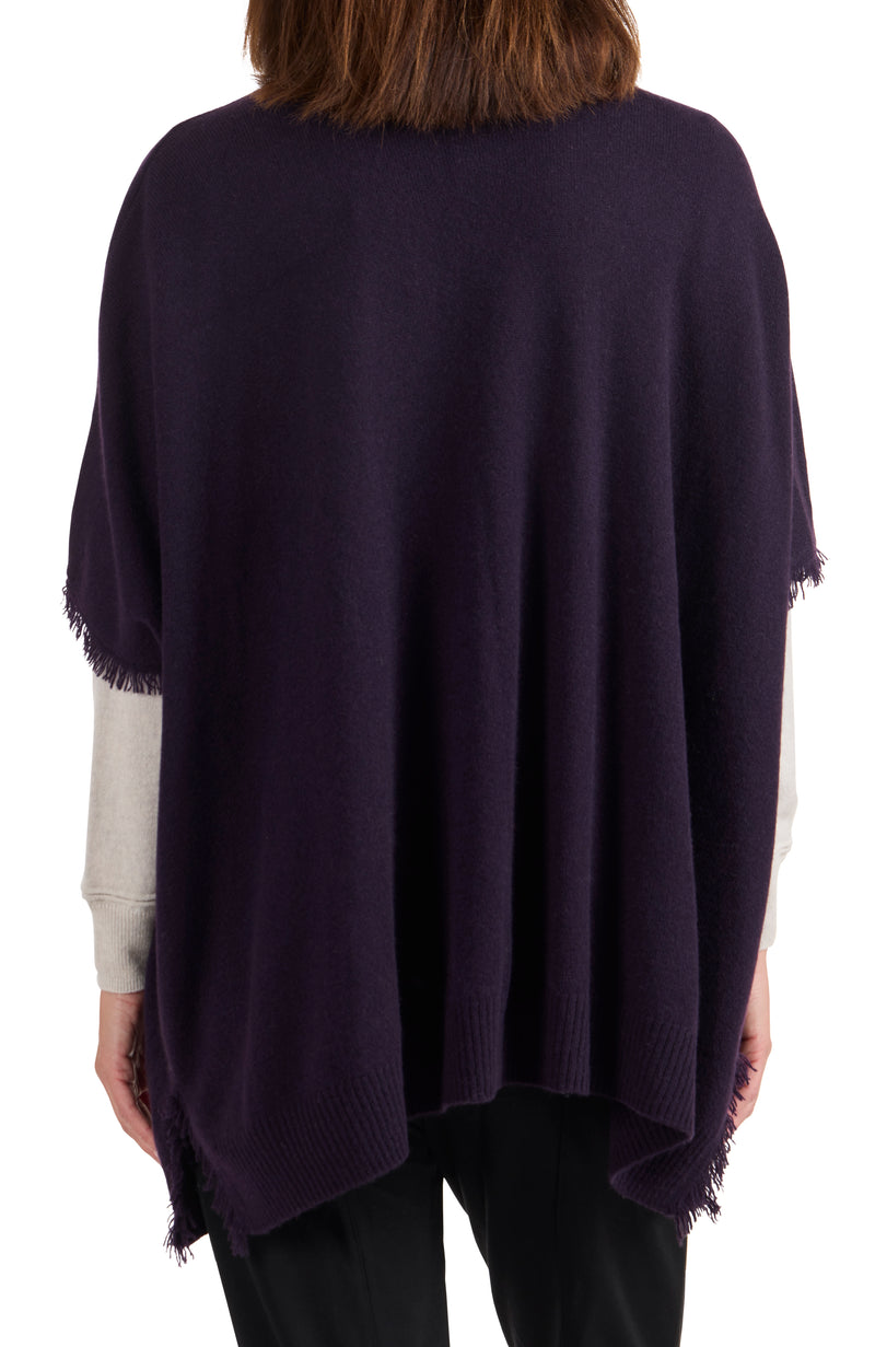 model wearing CASHMERE KNIT CAPE WITH FRINGE in dark currant back