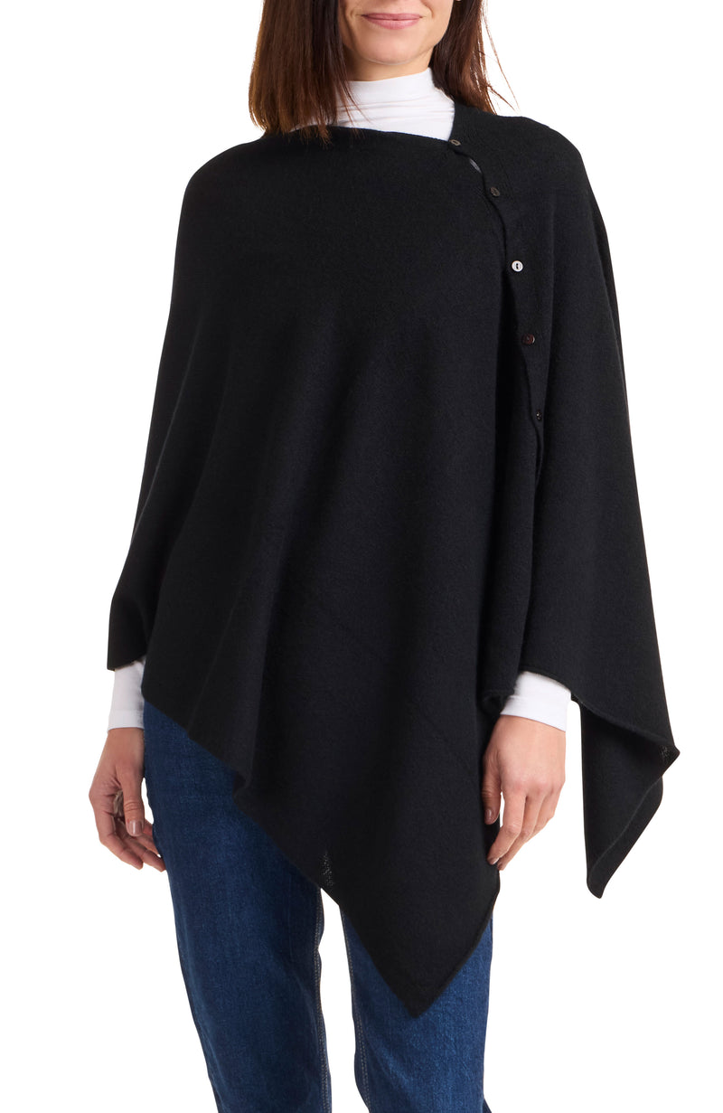 Model wearing CASHMERE BUTTON SHOULDER PONCHO + WRAP in black