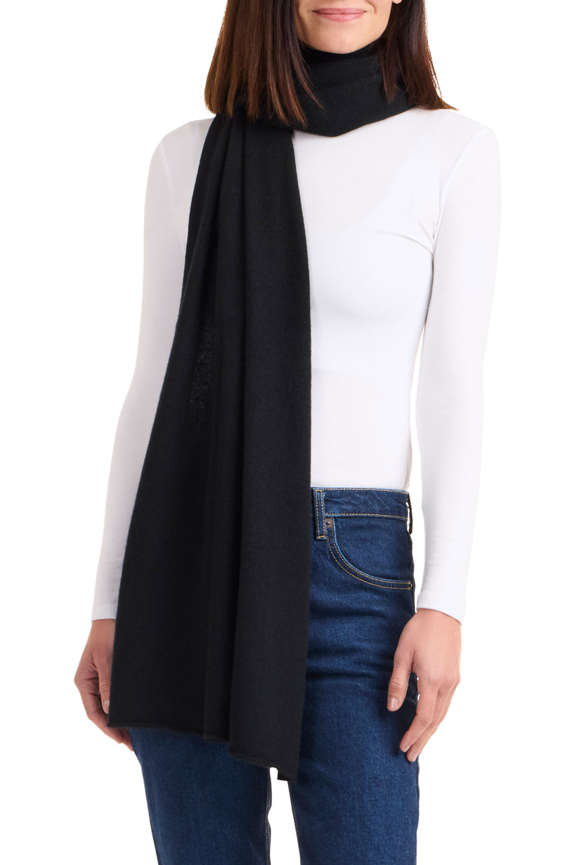 Model wearing CASHMERE BUTTON SHOULDER PONCHO + WRAP in black