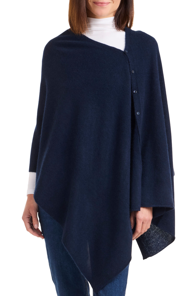 Model wearing CASHMERE BUTTON SHOULDER PONCHO + WRAP in navy