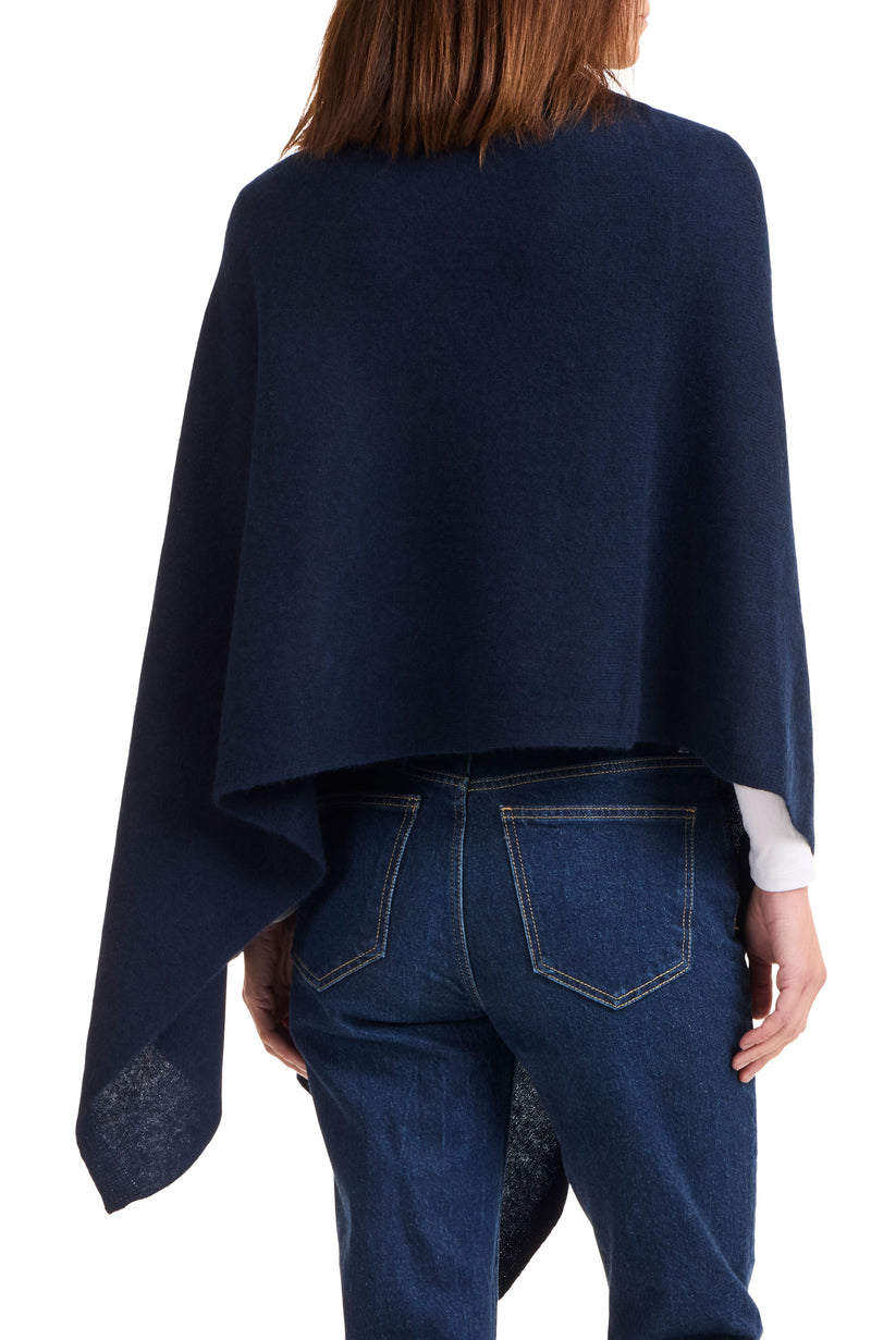 Model wearing CASHMERE BUTTON SHOULDER PONCHO + WRAP in navy