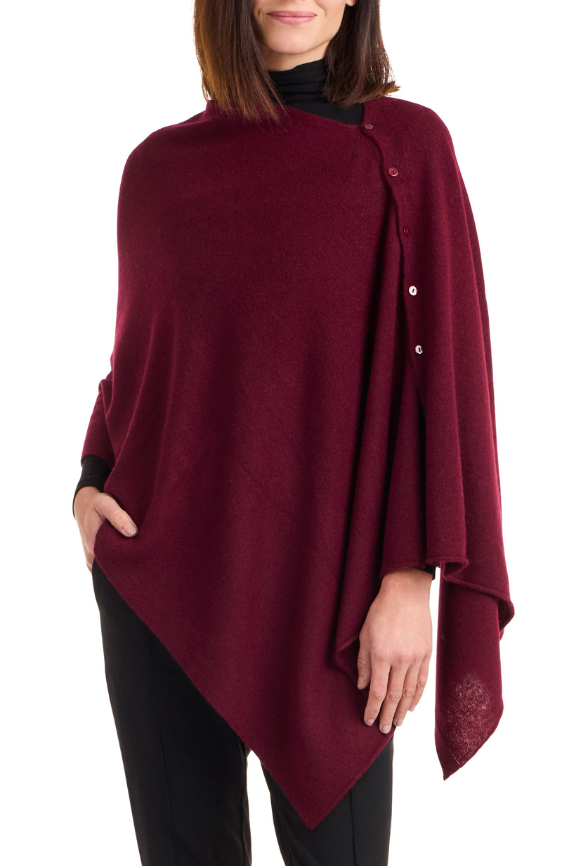 Model wearing CASHMERE BUTTON SHOULDER PONCHO + WRAP in bordeaux