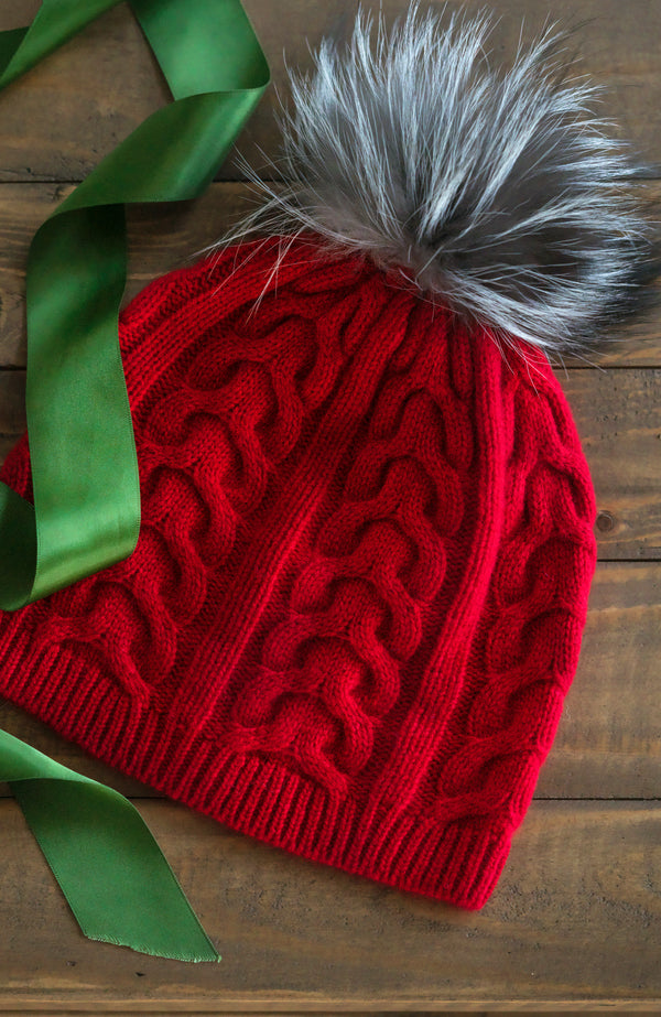 CASHMERE CABLE KNIT HAT WITH FOX POM with ribbon in red