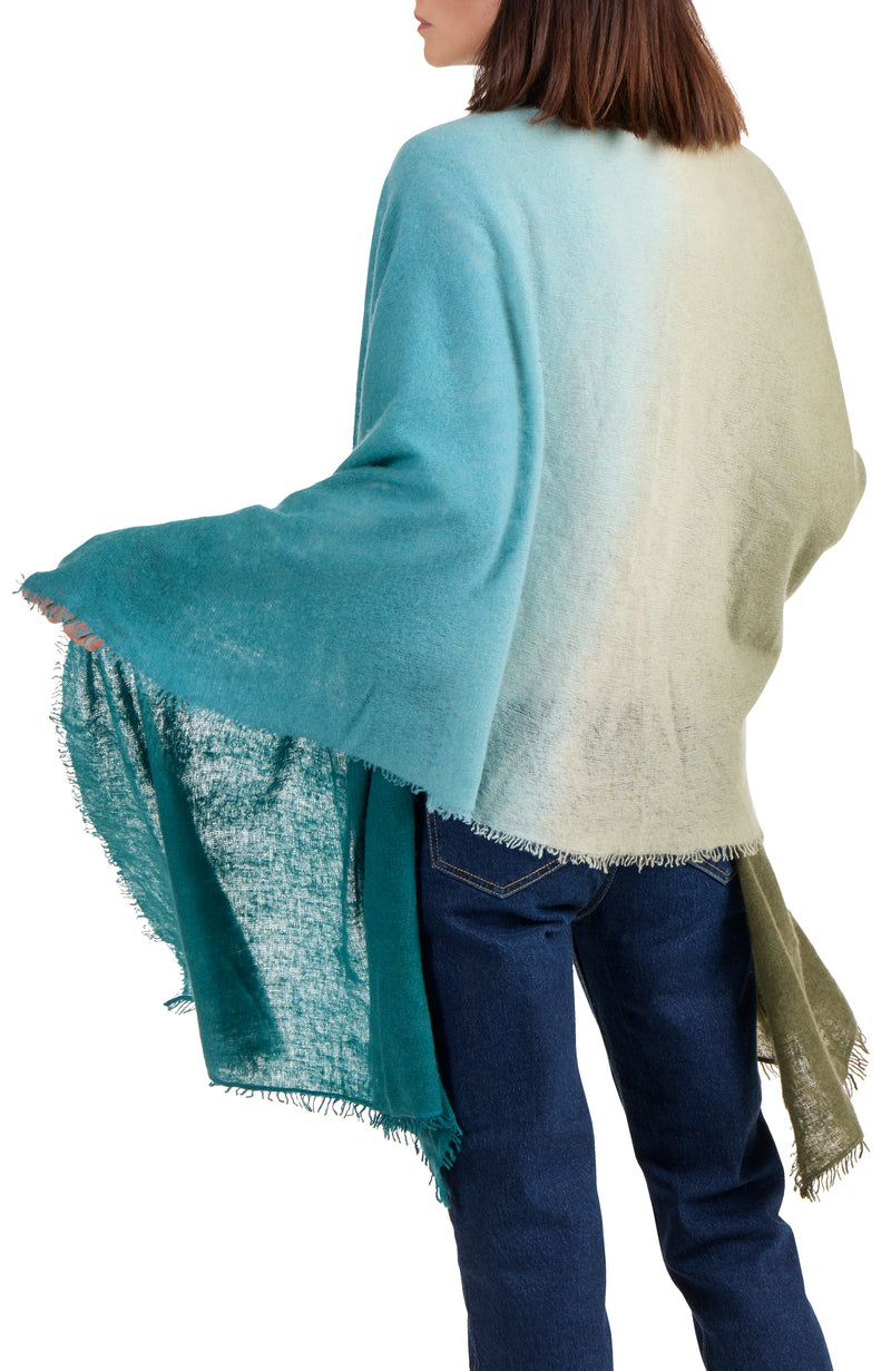 model wearing CASHMERE FELTED DIP DYE SCARF WITH FRINGE in olive-teal